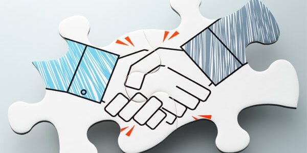 Handshake jigsaw puzzle pieces on reflection background.